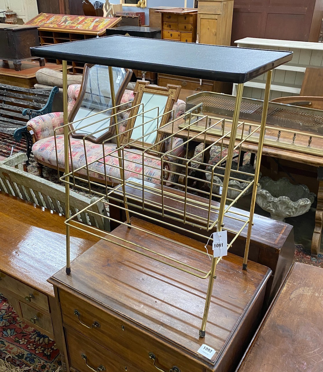 A 1950's gilt metal side table magazine rack, width 56cm